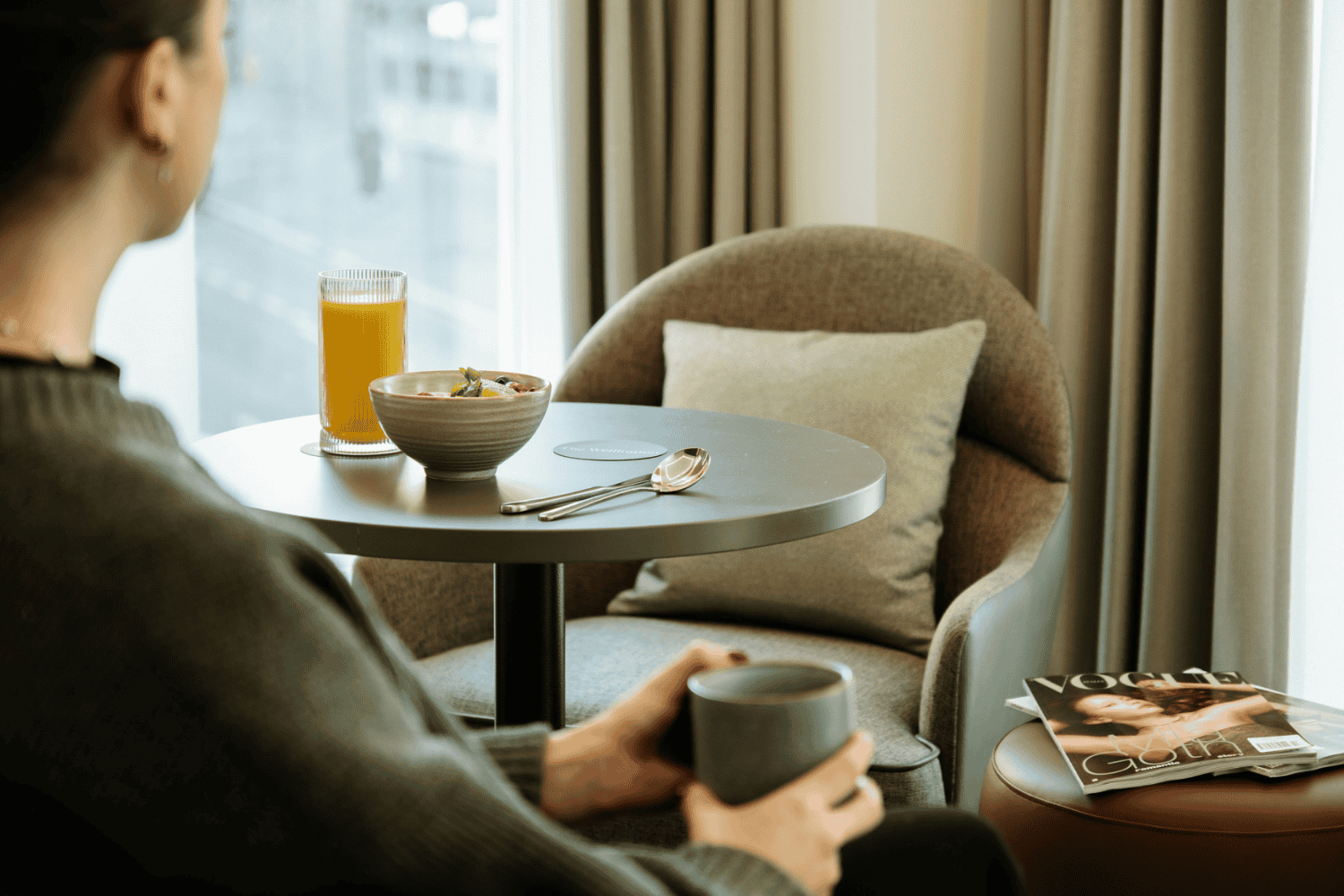 Serviced apartment living at The Wellington Glasgow by Adina with guest enjoying breakfast and coffee, perfect for extended stays in Glasgow